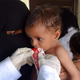 A woman holds a malnourished child at a treatment center in Yemen’s western province of Hodeida, on October 16, 2021.